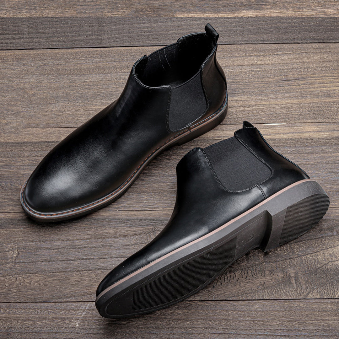 Close-up of the elastic goring on men's classic brown Chelsea boots, for easy wear