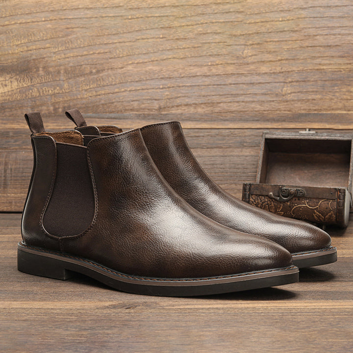 Men's dark brown leather Chelsea boots, front view, representing timeless men's fashion