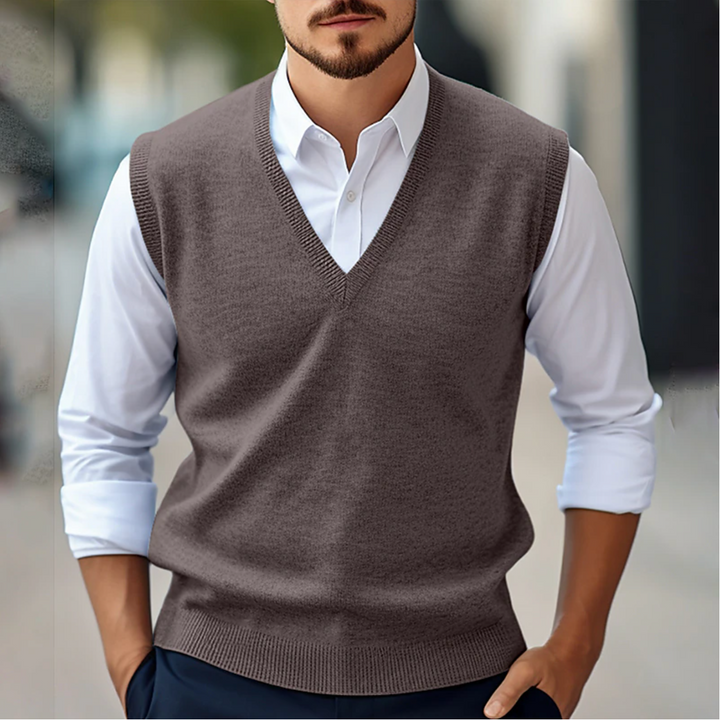 Close-up of a men's V-neck knit sweater vest, showcasing the knitwear texture and quality.