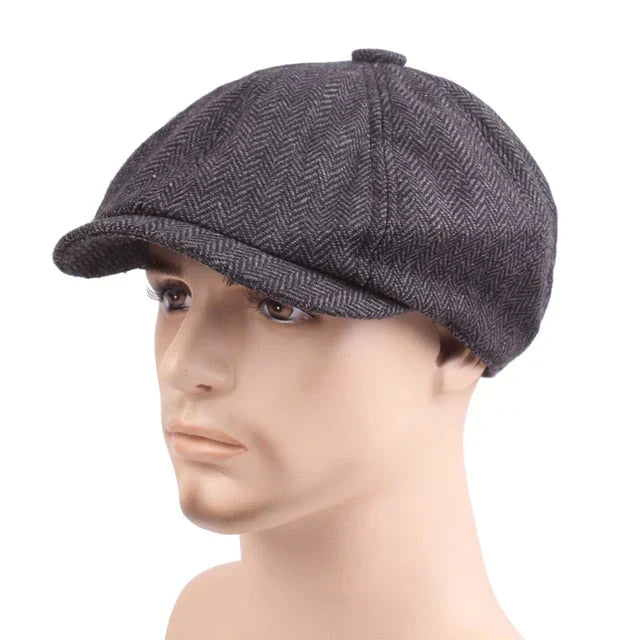 Side profile of a men's classic flat cap. Vintage style newsboy cap, a timeless fashion accessory for gentlemen.