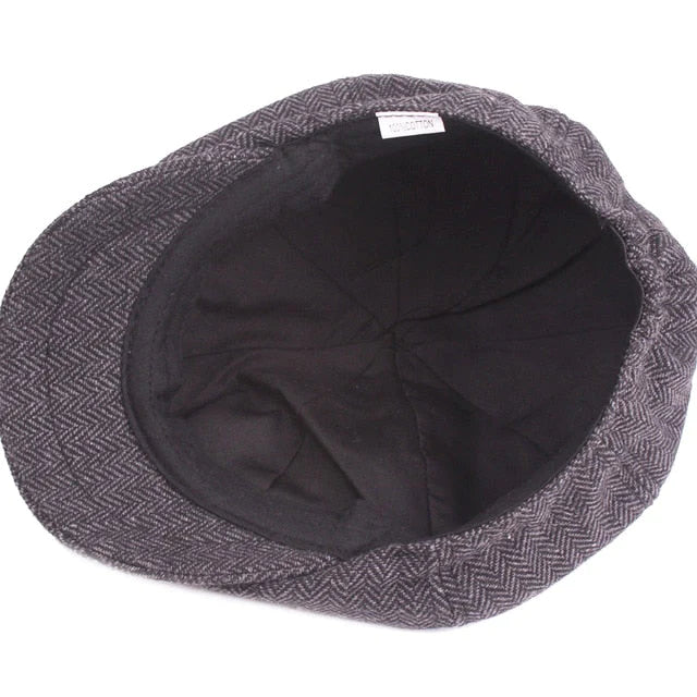 Man wearing a classic vintage flat cap. Stylish gentleman's hat, perfect fashion accessory for casual wear.