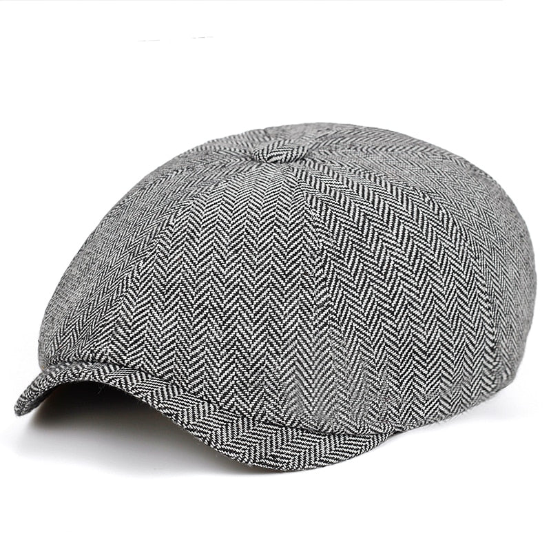 Elegant men's flat cap. Vintage style baker boy hat, a timeless fashion accessory, ideal for a refined casual look.