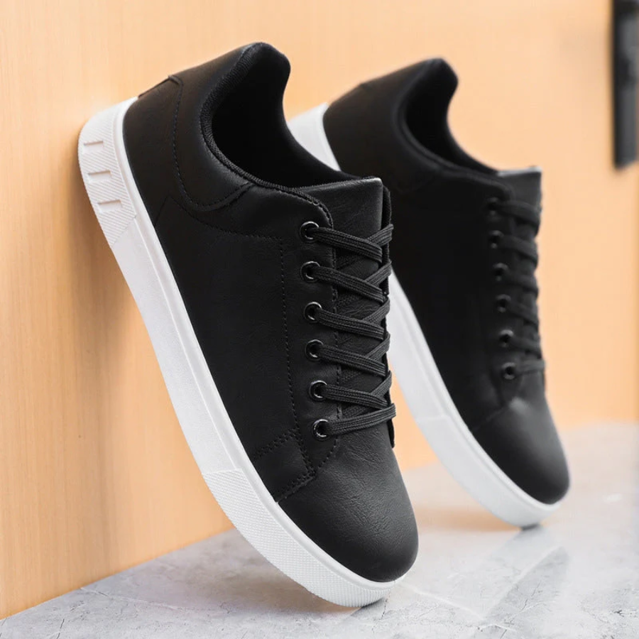 Pair of men's white comfort sneakers, lace-up low-top design for versatile footwear