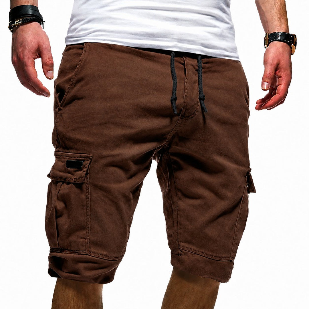 Man enjoying an outdoor summer walk in comfortable, relaxed fit multi-pocket cargo shorts. Perfect for adventure.