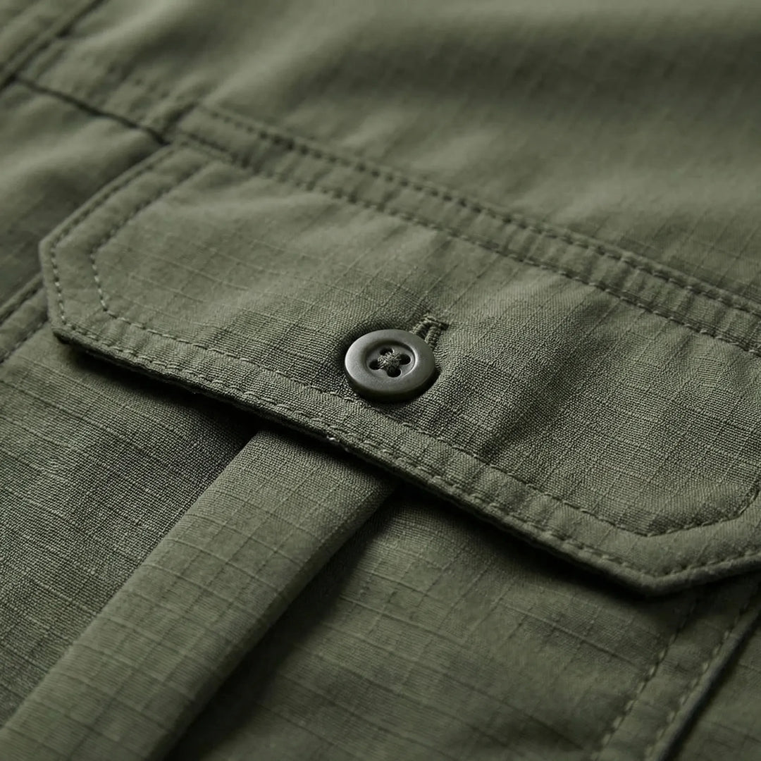 Lightweight men's utility shirt with quick-dry fabric and zip-off sleeves, ideal for fishing & adventure gear.