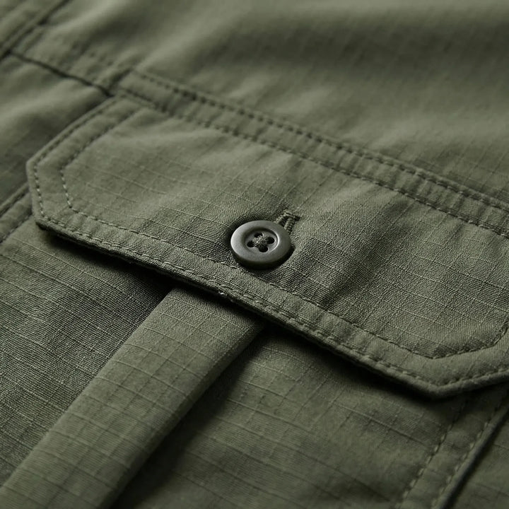 Lightweight men's utility shirt with quick-dry fabric and zip-off sleeves, ideal for fishing & adventure gear.