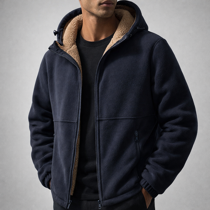 Close-up of the textured fleece fabric on a men's warm zip-up jacket for cold weather.