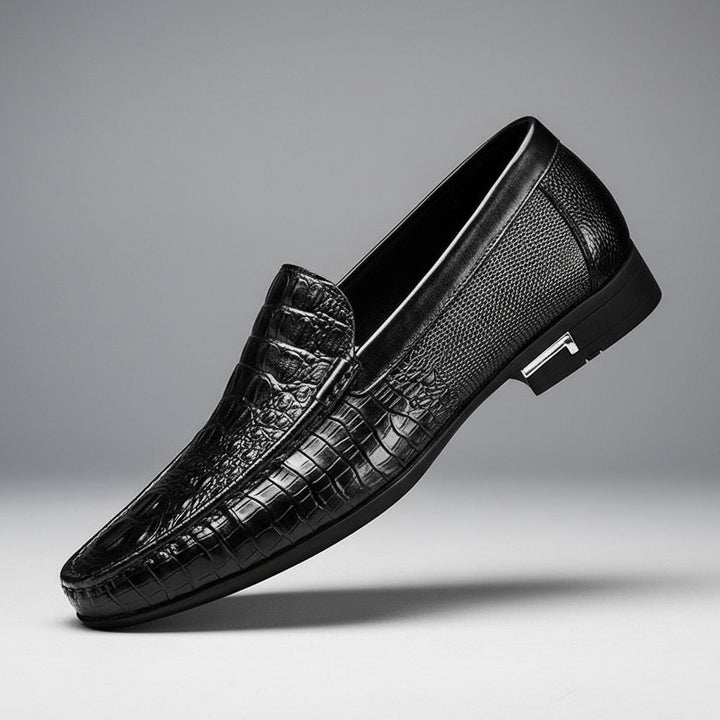 Modern men's crocodile embossed slip-on loafers. Sophisticated dress shoes for professional style or smart casual looks.