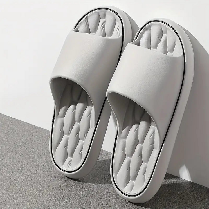 Lightweight men's waterproof pillow slides. Comfortable slip-on sandals for beach, pool, and casual summer wear.