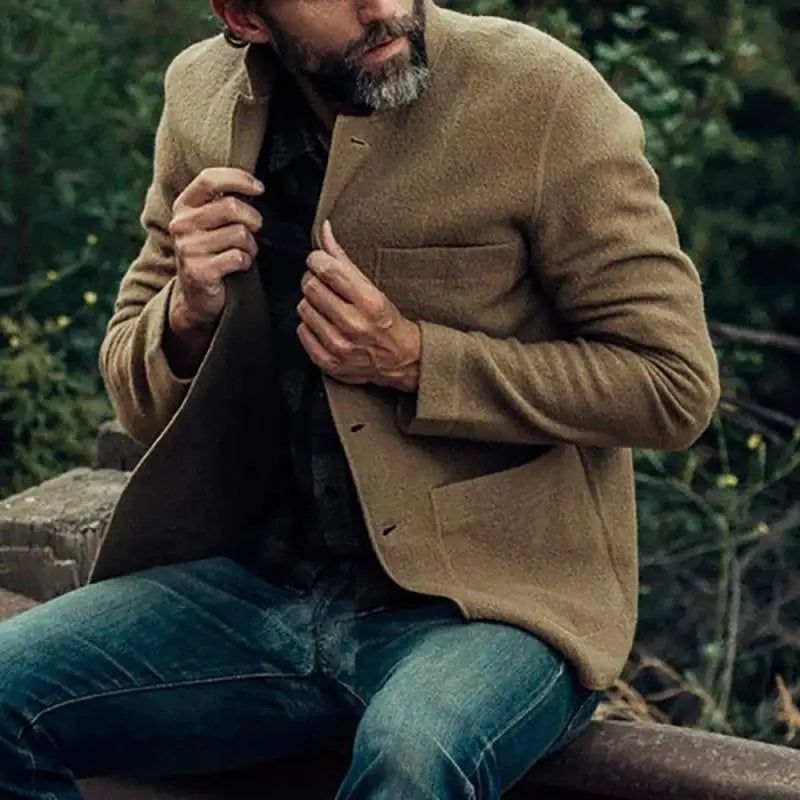 Man wearing a stylish men's slim fit tailored cardigan, long sleeve, perfect for a modern layered look.
