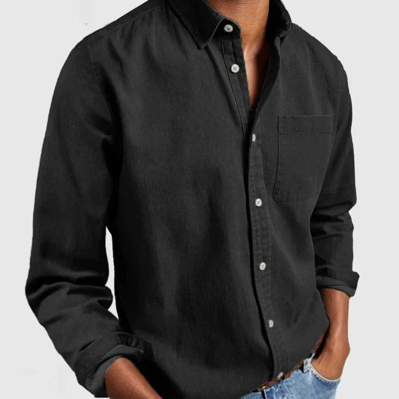 Stylish men's long-sleeve denim shirt, classic button-up design. Ideal for versatile casual and smart casual autumn wear.