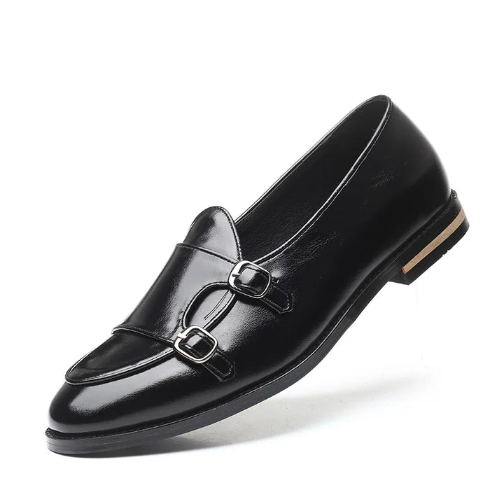 Side profile of men's black leather double monk strap loafers, modern design
