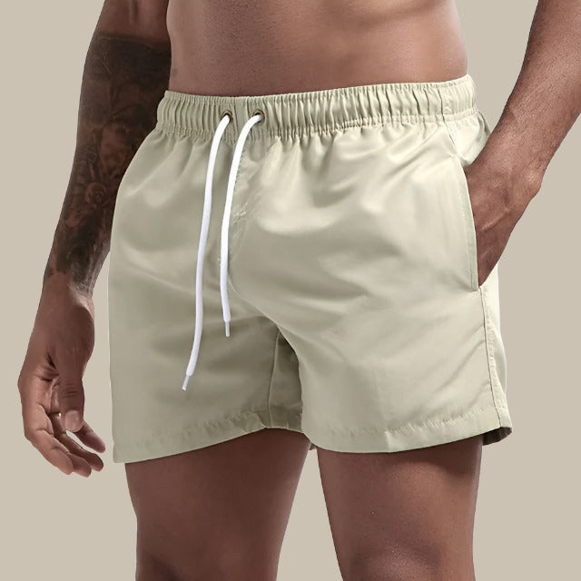 Men's drawstring swim shorts for summer comfort & style. Perfect beach & pool wear.