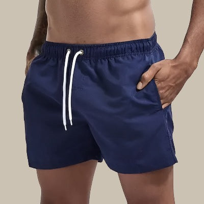 Modern men's fashion swim shorts with drawstring, sleek & comfortable for summer beach looks.