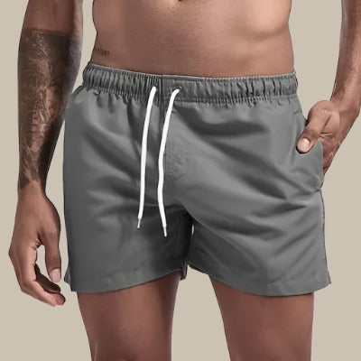 Essential men's drawstring swim shorts, a comfortable & stylish staple for summer swimwear.