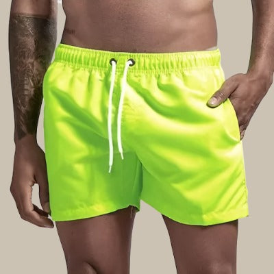Athletic men's swim shorts with drawstring, ideal for beach, pool, and active summer sports.