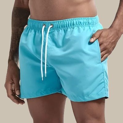 Versatile men's beachwear drawstring shorts, essential for summer vacations & pool days.