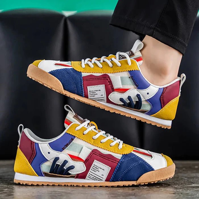 Men's durable patchwork utility sneakers in an urban outdoor setting.
