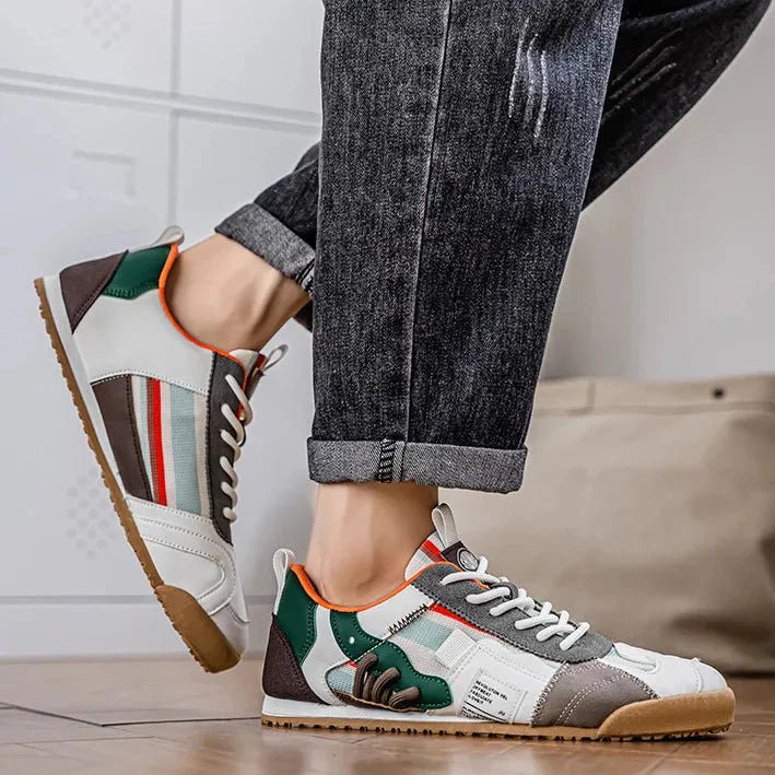 Close-up of durable patchwork material on men's utility sneakers, showcasing texture.