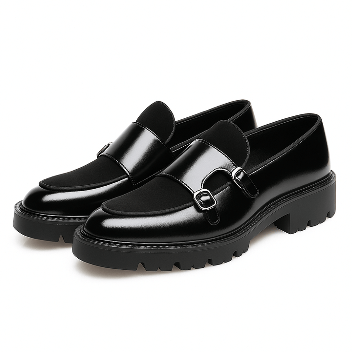 Black men's monk strap loafers with dual buckles, versatile for dressy or smart casual outfits.