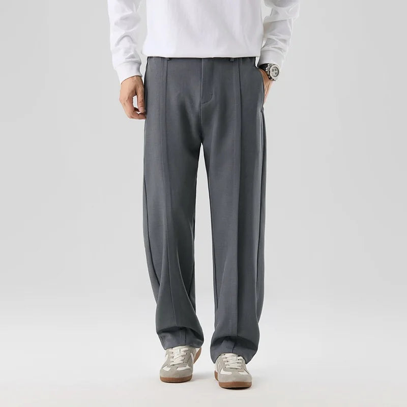 Men's black drape trousers styled for a formal look, offering refined comfort & elegant versatility.