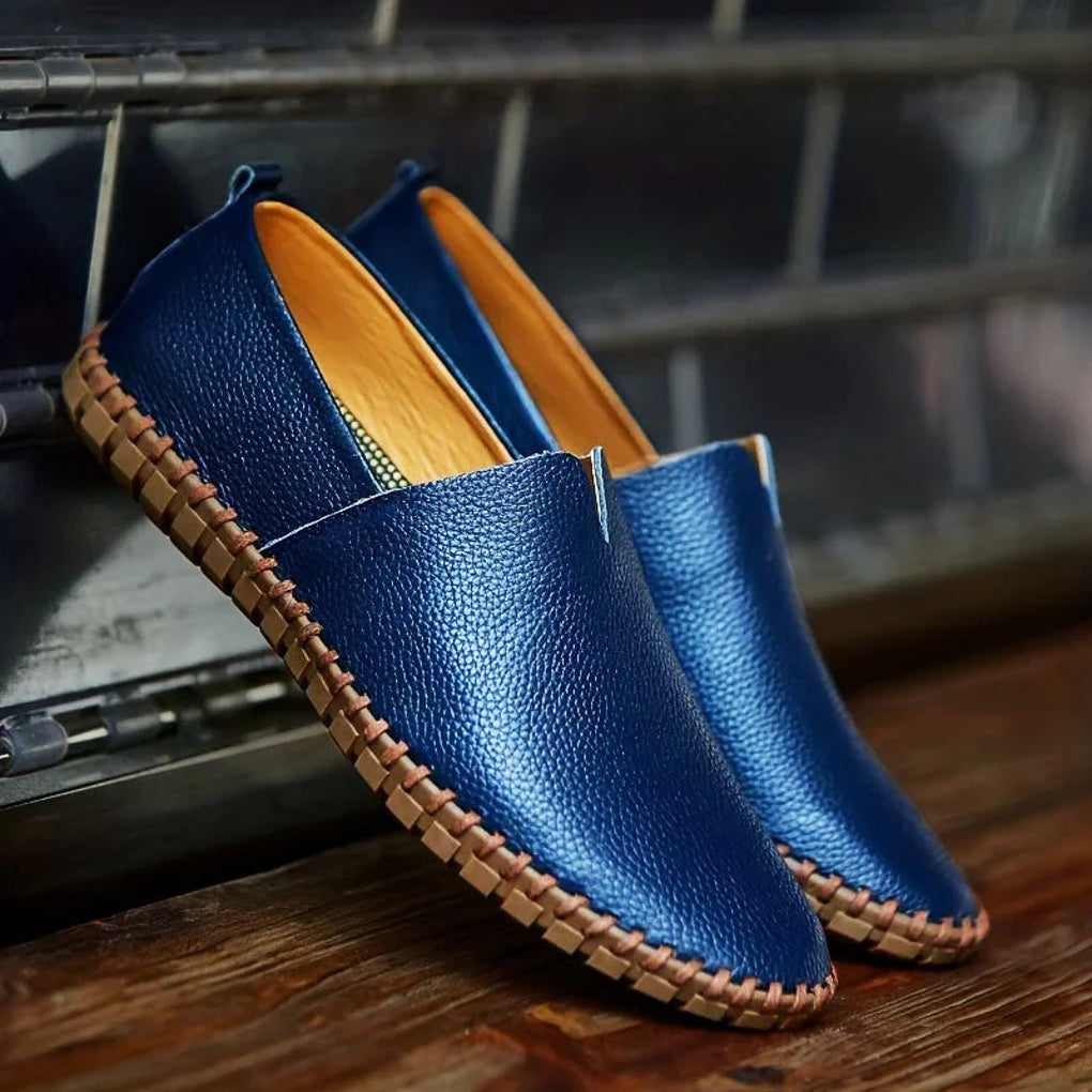 Dark blue men's matte slip-on loafers, perfect as dress shoes or casual, comfortable footwear.