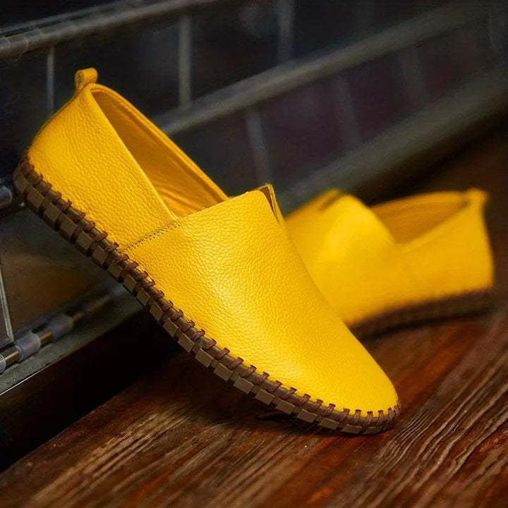 Stylish men's matte slip-on loafers, dark blue with subtle detailing, offering comfort & elegance.