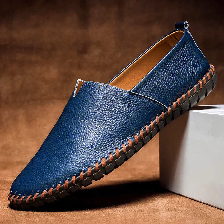 Pair of comfortable men's matte slip-on loafers, available in dark blue, perfect for all-day wear.