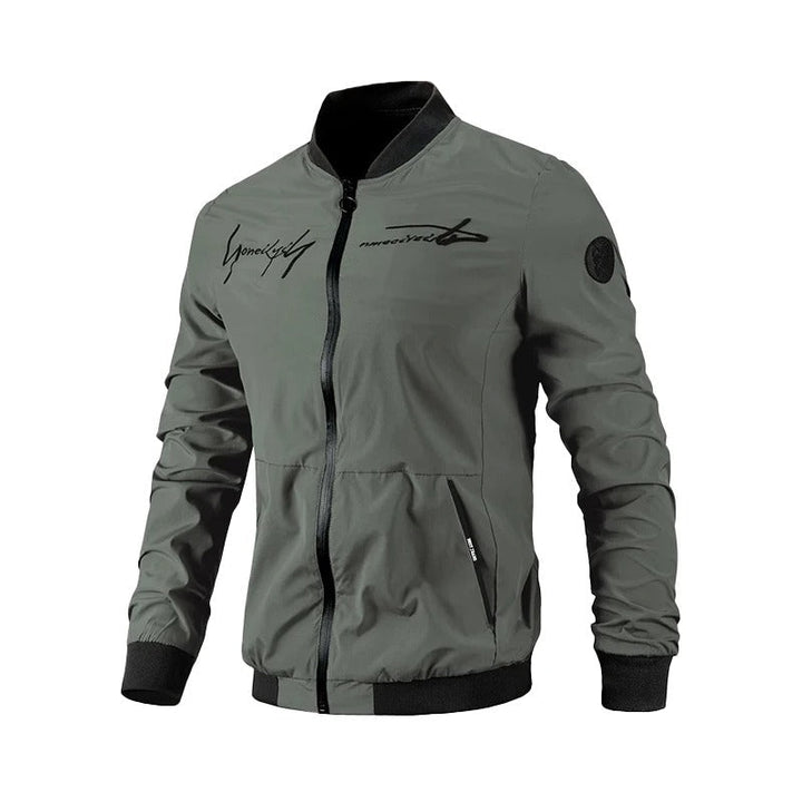 Men's embroidered bomber jacket in black for transitional weather. Stylish casual outerwear for spring & fall fashion.
