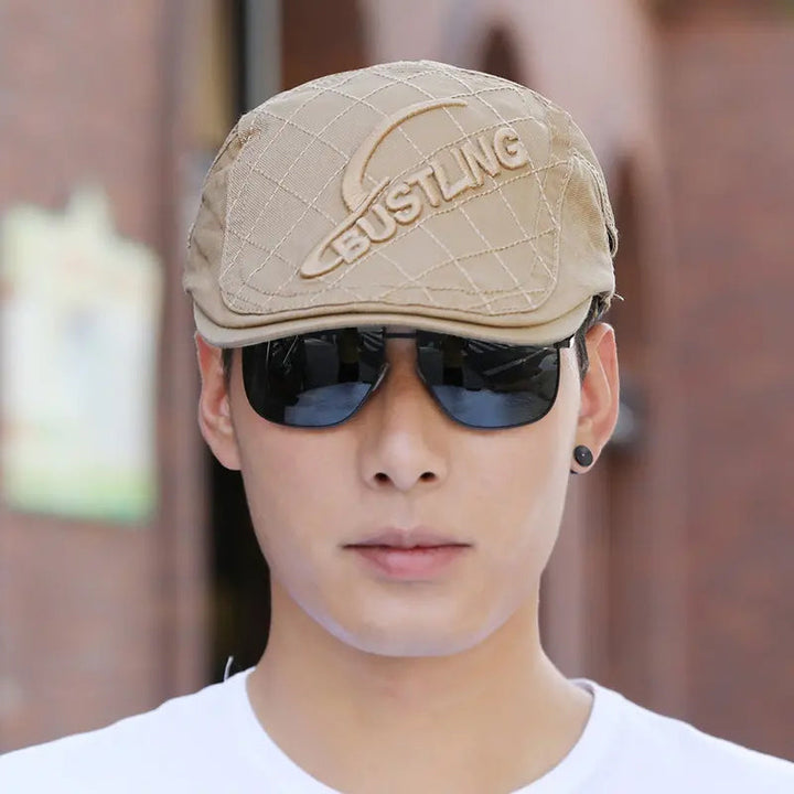 Stack of multiple men's embroidered cotton berets, available in various colors, stylish headwear.
