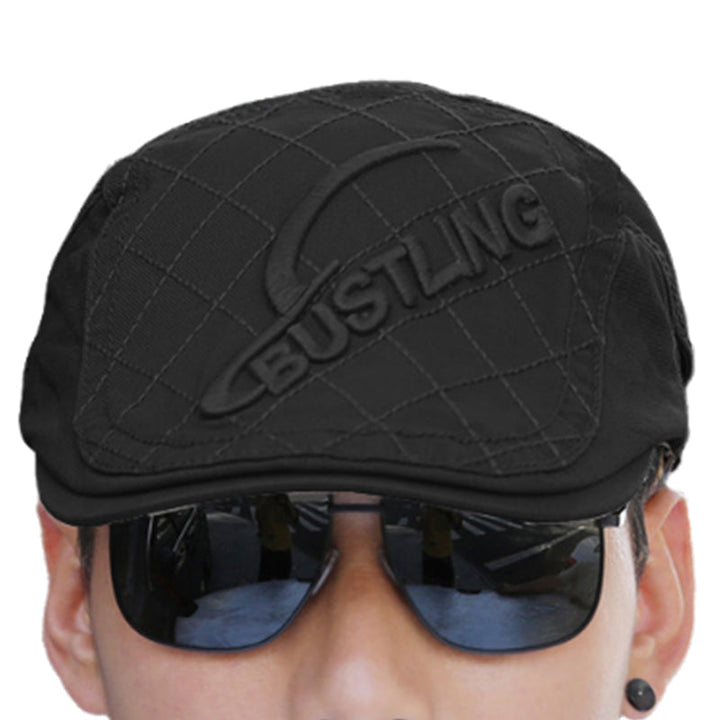 Close-up of the beret's brim and embroidery, essential details for this men's cotton hat.