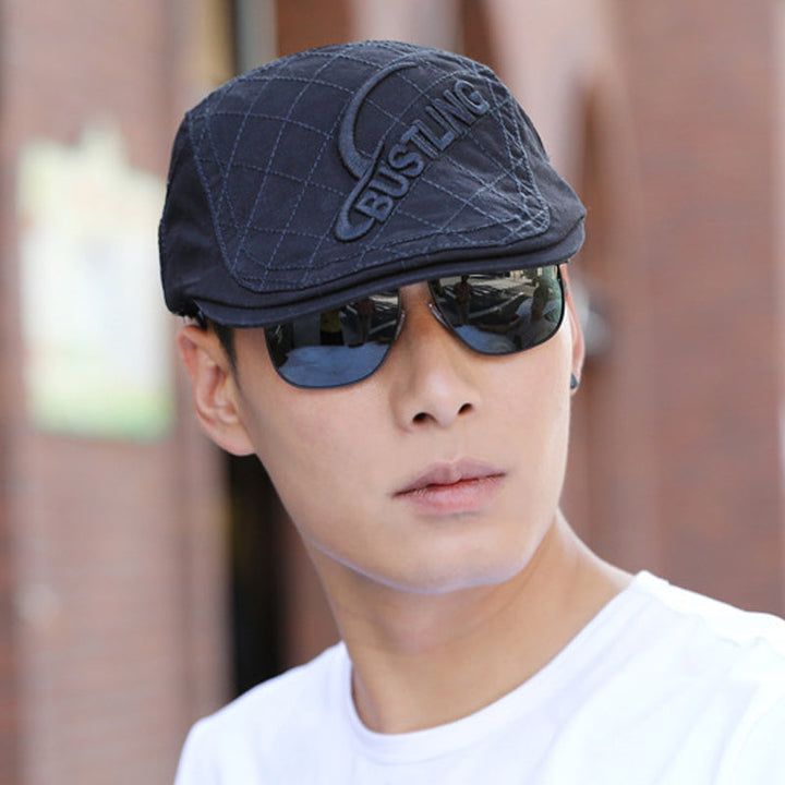 Men's embroidered cotton beret paired with a casual outfit, a versatile men's fashion accessory.
