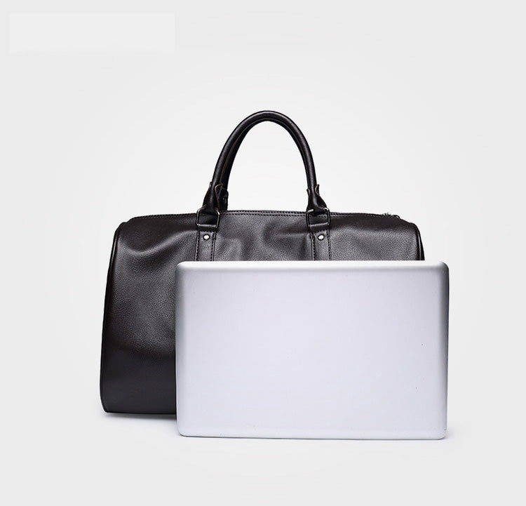 Durable faux leather duffel bag, stylish men's luggage for travel gear.