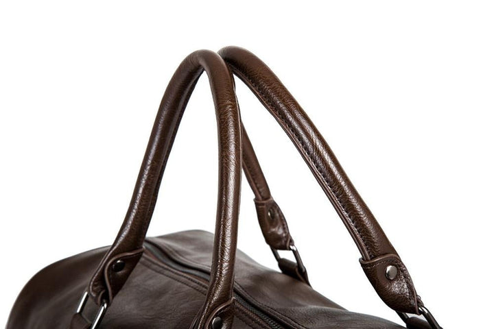 Practical men's faux leather duffel bag, spacious luggage for travel gear.