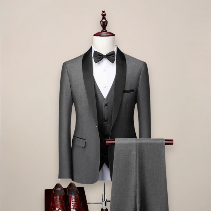 Full shot of a man wearing a sophisticated 3-piece formal suit, suitable for summer events.