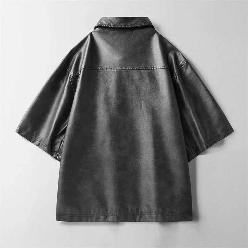 Detailed shot of the collar and buttons on a men's stylish genuine leather short-sleeve top.