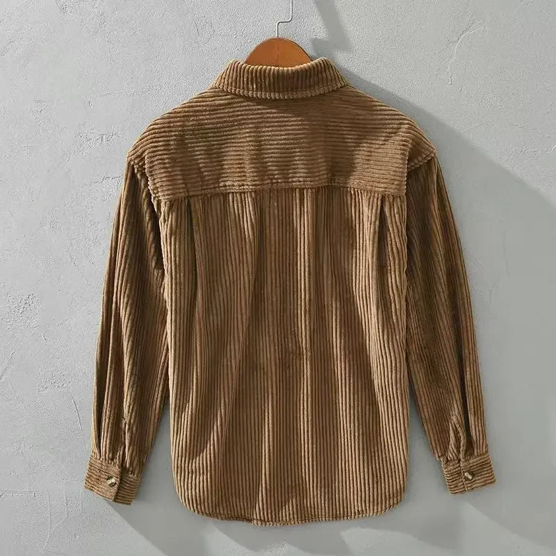 Flat lay of men's brown ribbed corduroy overshirt, utility shirt with front pockets