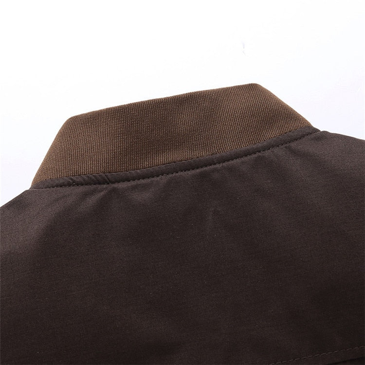 Man wearing a green vintage bomber jacket, lightweight for comfortable spring fashion.