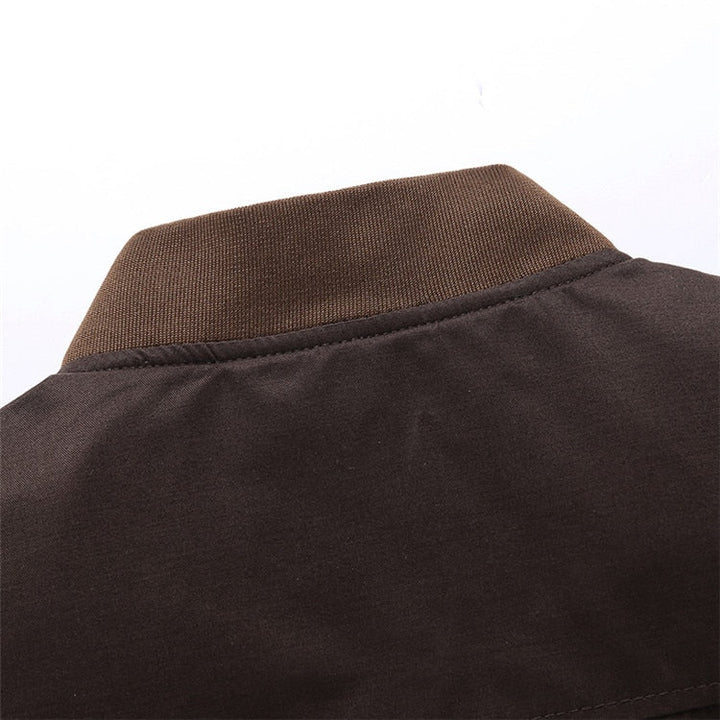 Man wearing a green vintage bomber jacket, lightweight for comfortable spring fashion.