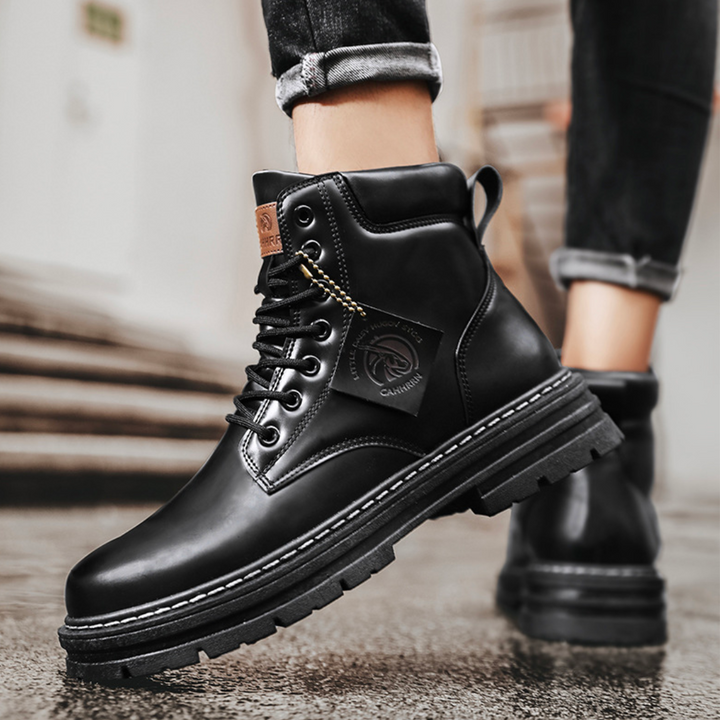 Close-up of men's durable lace-up ankle boots, thick sole and sturdy laces, ideal for outdoor use