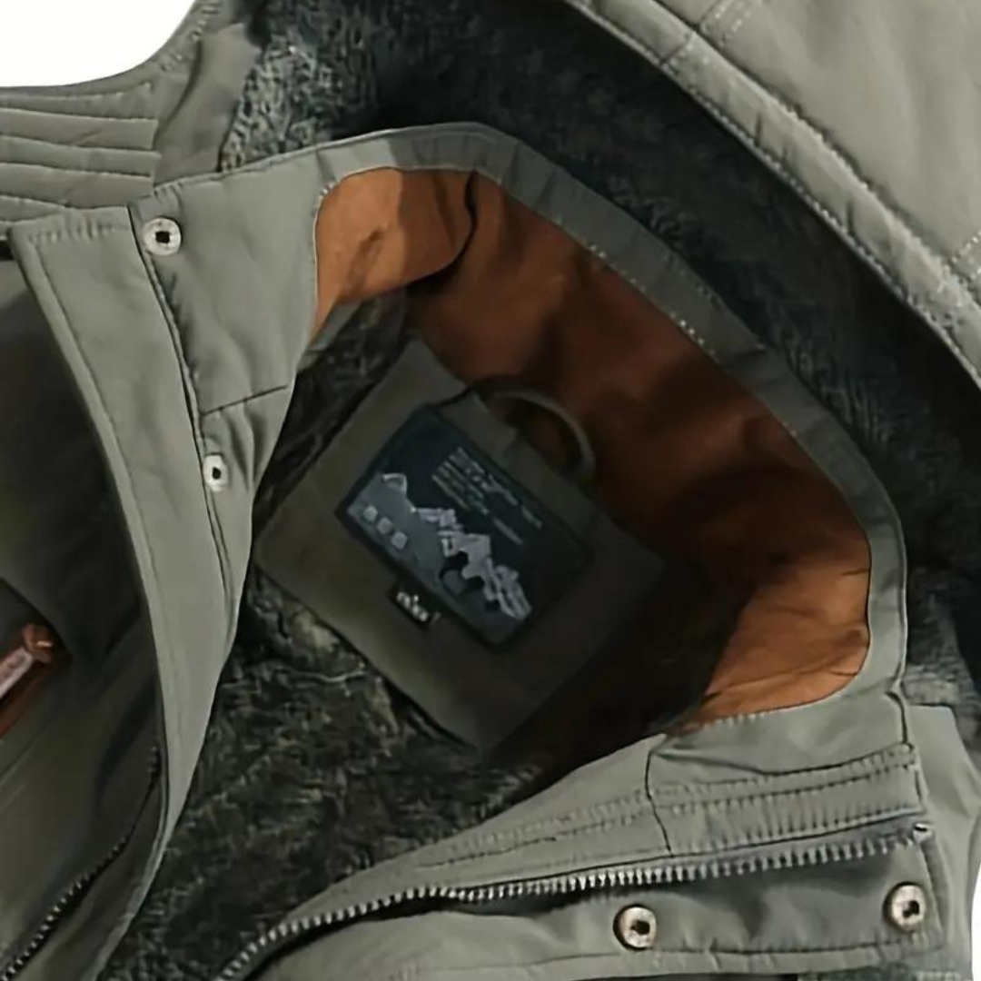 Close-up of durable men's insulated outdoor jacket. Waterproof, windproof, warm for winter protection & cold weather.