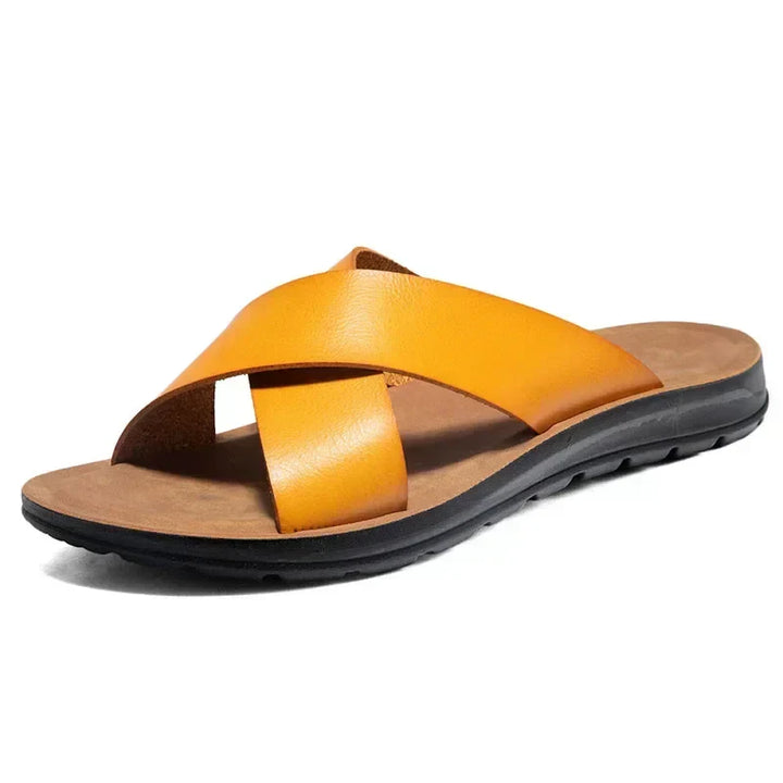 Detailed view of men's Italian style leather slip-on sandals. High-quality summer casual footwear.