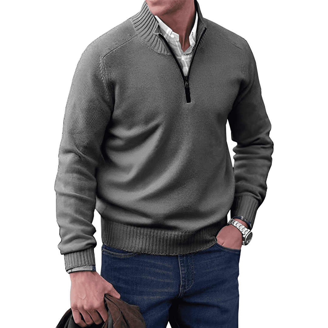 Texture shot of the knitted fabric on a men's winter jumper, emphasizing its cozy knitwear feel.