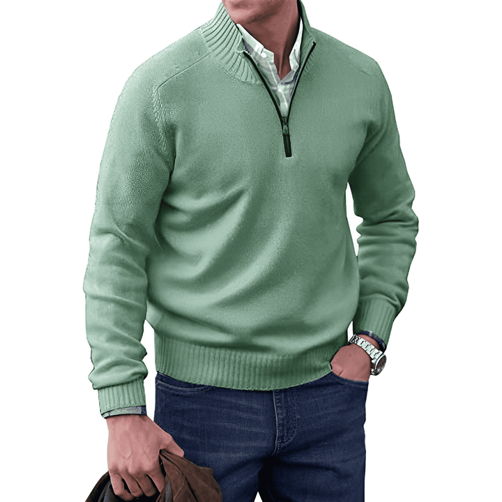 Side view of a man in a long sleeve knitted half-zip pullover, demonstrating its comfortable fit.