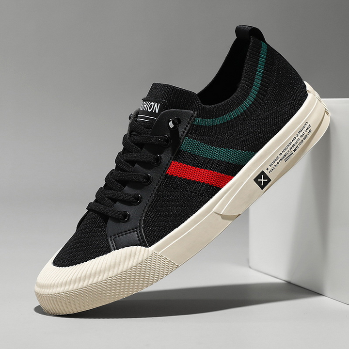 Pair of men's lightweight breathable lace-up sneakers, offering all-day comfort for casual athletic & active lifestyles.