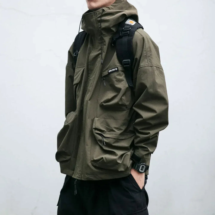 Yellow men's hooded windbreaker jacket with adjustable cuffs & multi-pockets, ideal for outdoor activities.