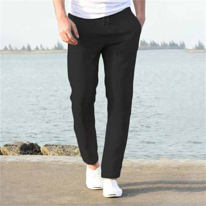 Relaxed fit men's linen blend trousers, offering lightweight comfort & breathability for spring and summer fashion.