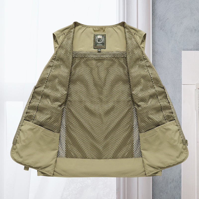 Dark blue men's multi-pocket vest, lightweight utility for hiking, fishing, & outdoor travel.