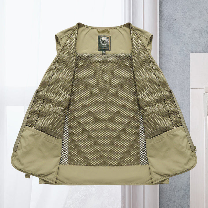 Dark blue men's multi-pocket vest, lightweight utility for hiking, fishing, & outdoor travel.