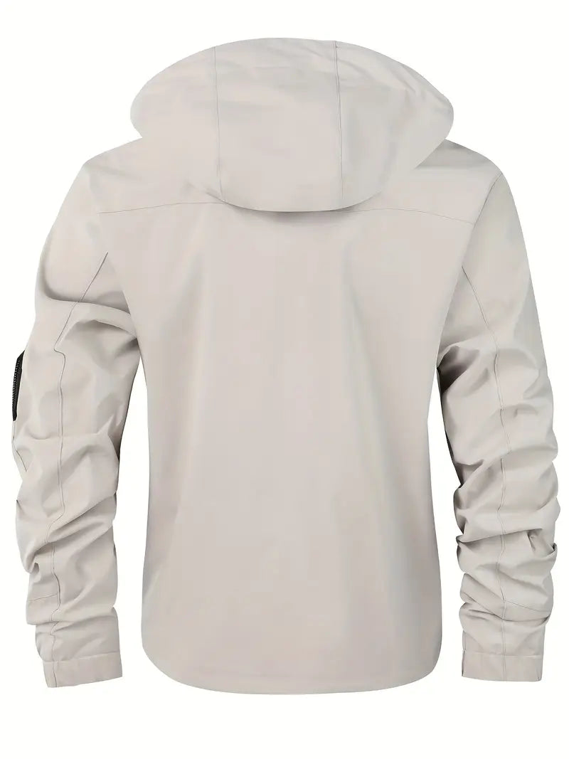 Men's lightweight hooded outdoor jacket in action, windproof & waterproof, keeping you dry & comfortable outdoors.